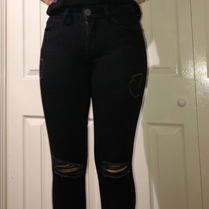 Black ripped low rise jeans